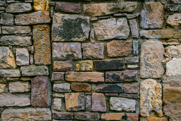 Texture from the pattern obtained from the folded stones in the masonry when building an old stone house.