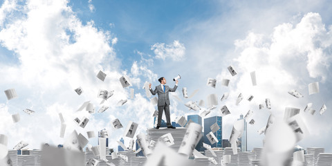 Businessman standing with megaphone.