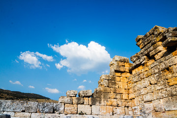 Fototapeta na wymiar Ruins of the ancient city Hierapolis in Pamukkale, Turkey in a beautiful summer day