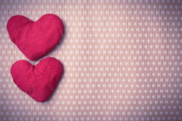 Valentine's Day. Colorful knitted hearts. Valentines day. Heart pendant. Vintage background in peas. Red heart. Handmade Hearts. Valentine cards. Space for text. Toned image.