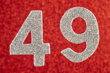 Number forty-nine silver color over a red background. Anniversary