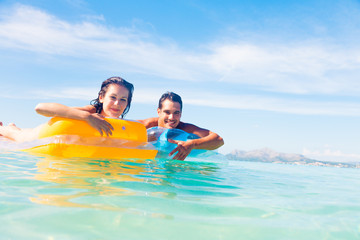 Young Couple With Pool Raft