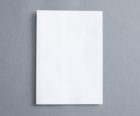 Blank white paper on the grey background