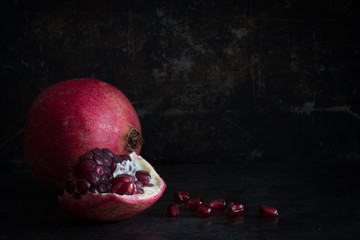 Pomegrante on a Dark Background with Copy Space Horizontal