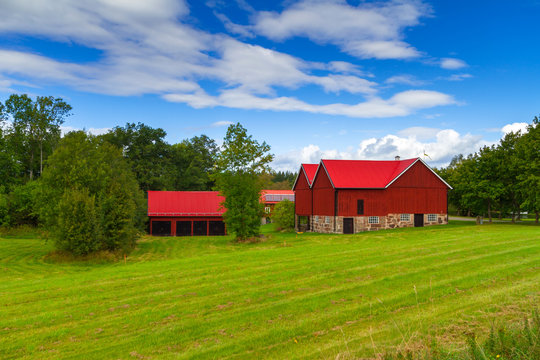 Wooden red cottage houses in scenery of Sweden