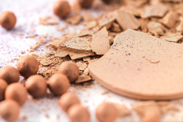 close-up shot of nude cosmetic powder on white