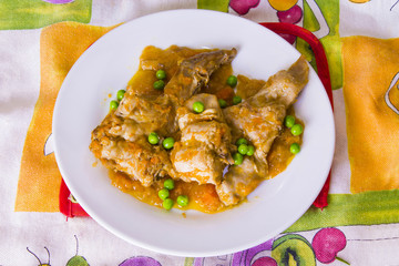 stew of rabbit with carrot and peas