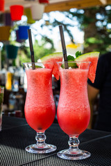 Watermelon smoothies in a glass cup on the bar