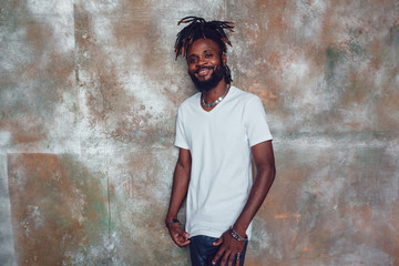 African American man with dreadlocks and a white T-shirt. Mock-up.