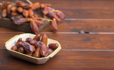 dried dates on a grey background