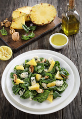 close-up of spinach cheese pineapple walnut salad