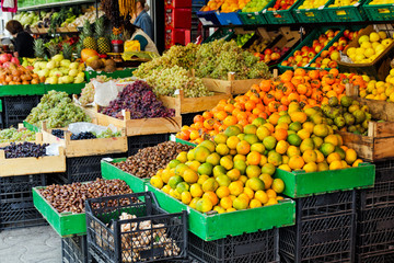 Concept of agriculture and farmers' products - the street trade of seasonal fruits - mandarins,...