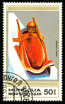 Ukraine - circa 2018: A postage stamp printed in Mongolia shows drawing Bobsled. Series: Winter sports. Circa 1989.