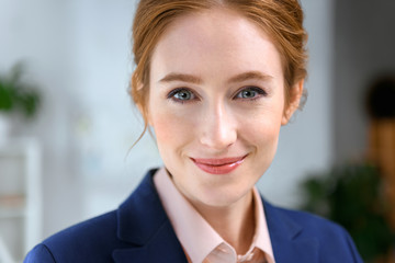 portrait of smiling businesswoman looking at camera