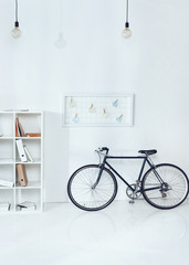 bicycle near wooden shelves in empty office