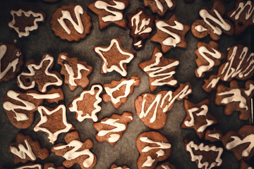 Vanilla cookies on white baking paper sheet.