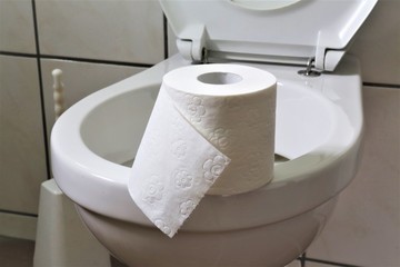 An concept Image of a bathroom with toilet paper