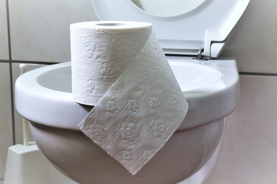 An concept Image of a bathroom with toilet paper