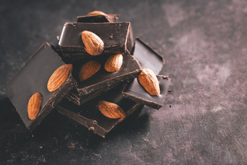 Fototapeta na wymiar Close-up of pieces dark chocolate with almonds.