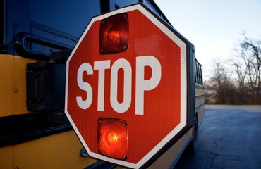 Red stop sign on school bus 