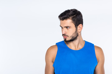 handsome young man looking at side isolated on white