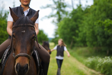 Obraz premium Young Woman Riding Her Horse
