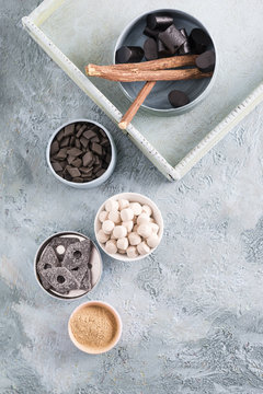 Bowls of licorice roots and different licorice products