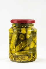 pickled gherkins with spices in a jar