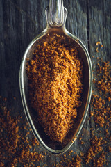 Spoon of ground nutmeg powder
