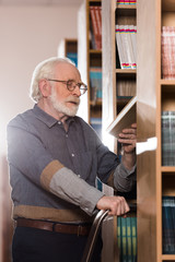 Senior man at library