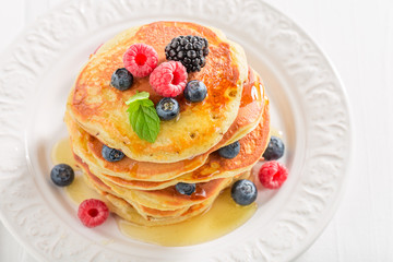 Sweet and delicious american pancakes with berries