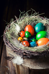 Closeup of eggs for Easter in wooden small henhouse