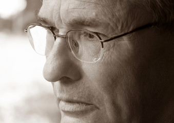 Senior Mature man, Portrait of a Sad Pensive elderly man with glasses