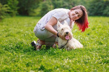 Young girl with a dog in the park