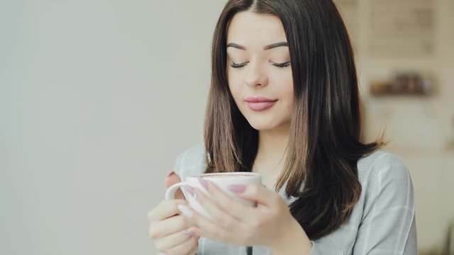 Young woman enjoy to drink coffee in cafe