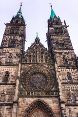 A front close up of details of facade of gothic catholic church St. Lorenz in Nurnberg, Bavaria,...