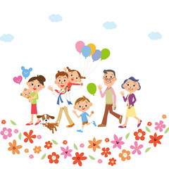 Obraz na płótnie Canvas お花の中を散歩する三世代家族