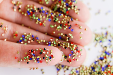 Small rhinestone in one hand