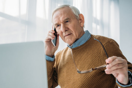 Senior Busy Man Working In Office And Making Phone Call