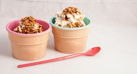 Panna cotta ice cream decorated with walnuts.