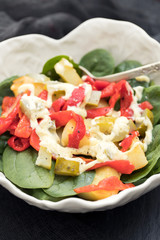 warm salad with potato , salted cucumber and red pepper