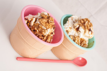 Panna cotta ice cream decorated with walnuts.