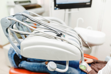 Closeup of dental drills and other medical instruments in stomatological cabinet