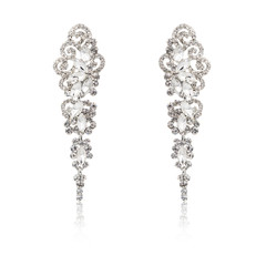 Pair of silver diamond earrings isolated on white