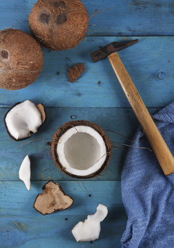 Opening coconut with hammer