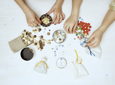 Women sorting buttons
