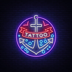 Tattoo salon logo in a neon style. Neon sign, emblem, anchor symbol with a ribbon, luminous billboard, neon advertising on a tattoo theme, for tattoo salon, studio. Vector illustration © Ivan