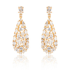 Pair of golden diamond earrings isolated on white