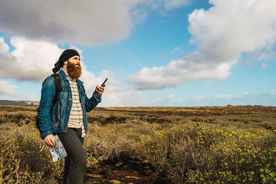 Tourist man with map and smartphone