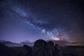 Milky way over ancient granite rocks